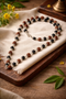Rudraksha Karungali Mala with German Silver Cap